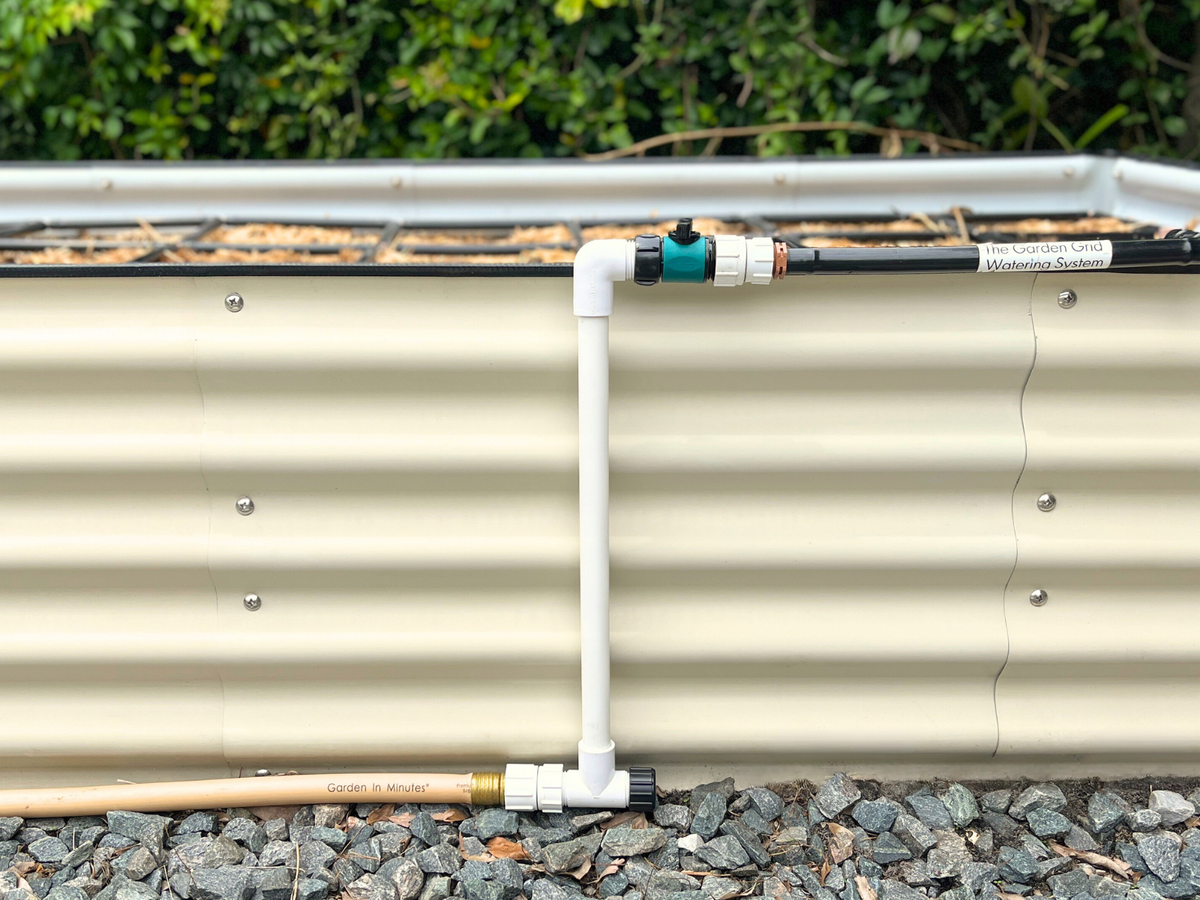 Garden Grid Watering System connected to a raised garden bed