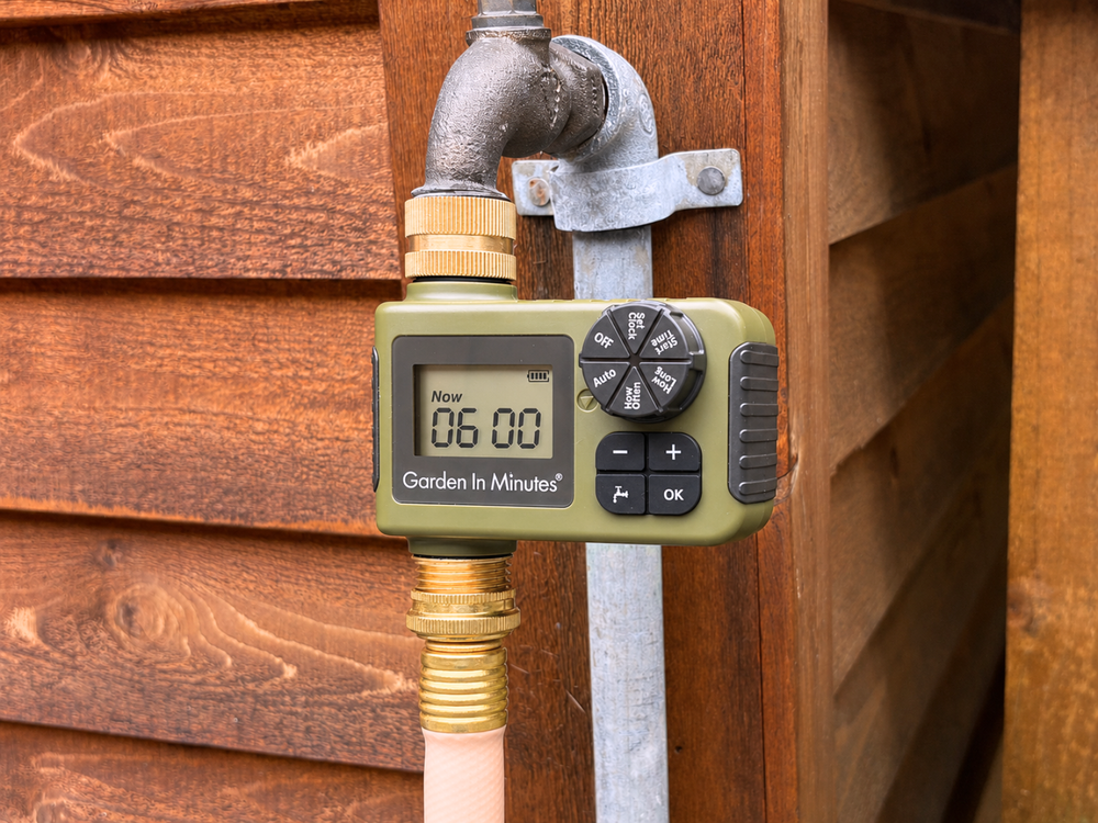 Garden In Minutes watering timer attached to an outdoor faucet