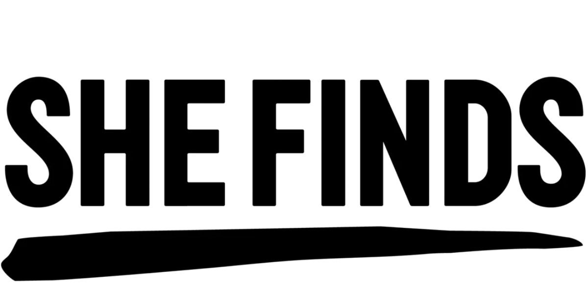 Black 'SHE FINDS' logo on a transparent background