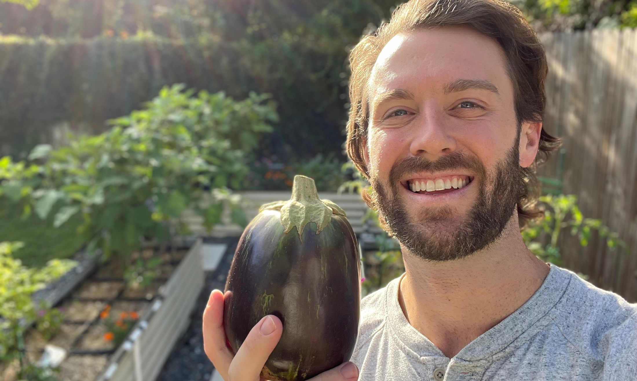 Bryan Holding Eggplant Cropped